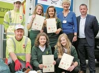 Kids help clean up litter trucks