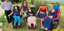 Wonder Woman accepts cheque from care home