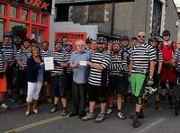 Bude Mountain Bike Riders hand over bike ride proceeds following cycle from Minehead to Plymouth