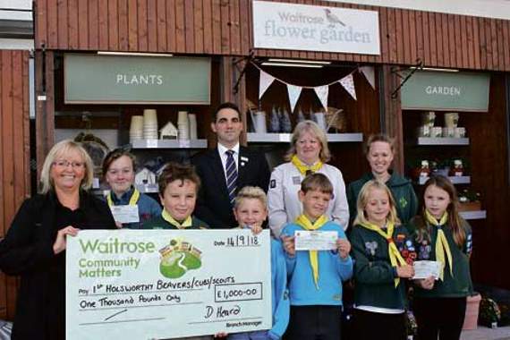 Cheque for £1,000 handed over to Scouts