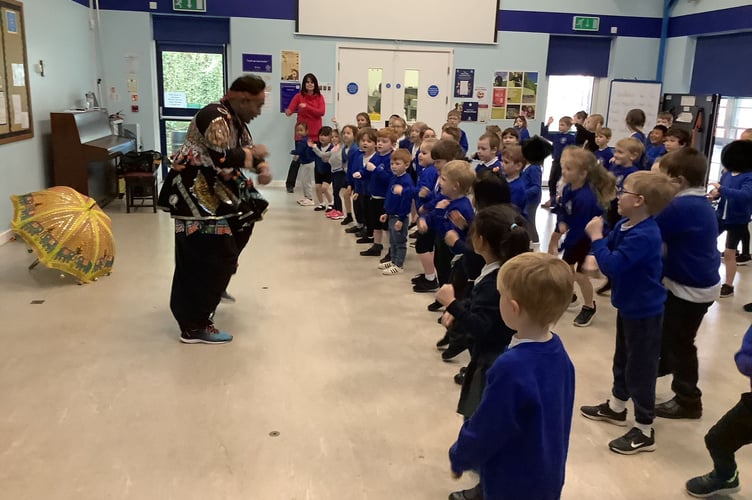 Kalpesh Zalavadiya teaching Windmill Hill Academy pupils an Indian dance 