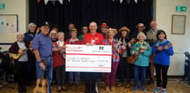 Ukulele band make £5,000 donation to Air Ambulance