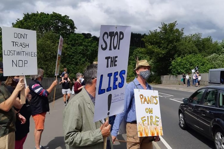 A protest against development at Gillyflower Golf Course. See SWNS story SWLNeden. Campaigners say a historic town and a nearby tourist attraction could be "destroyed forever" by controversial golf course plans. Sir Tim Smit - the millionaire co-founder of the Eden Project - had his initial scheme to change Gillyflower Golf Course rejected by council planners last April. The plans originally included 19 holiday lodges, a café and education centre on the course he owns in Lostwithiel, Cornwall. The rejection came after mass backlash from the local community - who submitted 300 objections and organised demonstrations.  