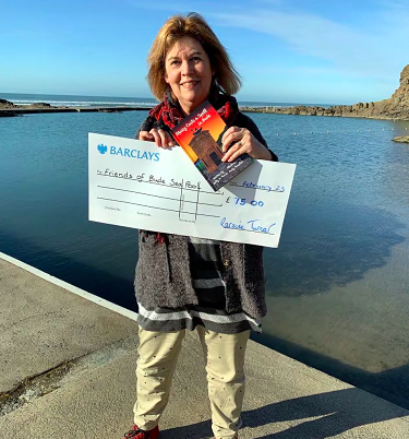 Laraine Turner, who writes under the name of Lally A Turner at Bude Sea Pool which has benefited from sales of the local book; Below, the three books in the series