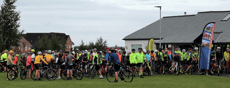 The cyclists line up for the charity ride