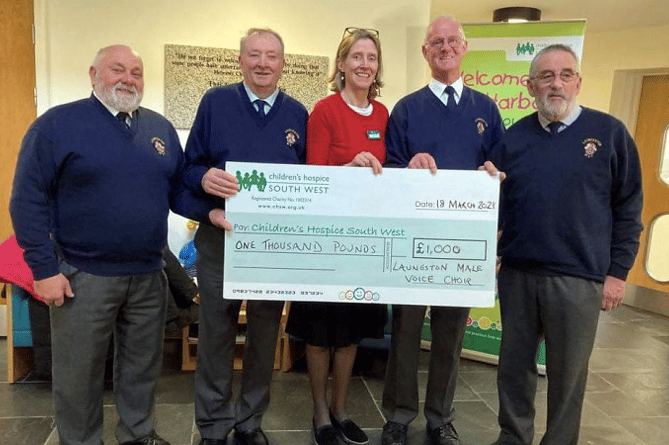 Pictured here are choir members who travelled to Little Harbour Hospice at St Austell to meet with Annabel Roberts (area fundraiser) and to proudly present a cheque for £1,000