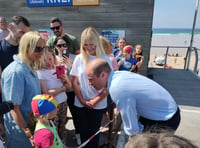 Prince William plays volleyball and meets lifeguards