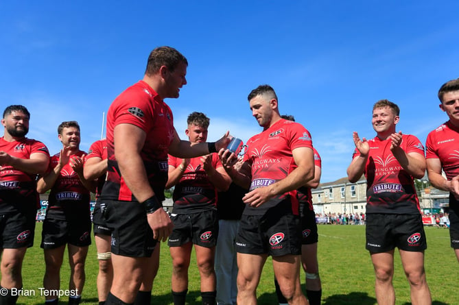 Cornish Pirates prop Jack Andrew presents Kyle Moyle with a tankard for reaching 150 appearances for the club. Picture: Brian Tempest