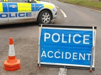 Bude road blocked by car on its roof