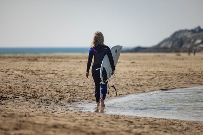 A surfer on Crantock beach