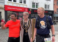 Town visited by Olympic torch for ultra marathon charity challenge