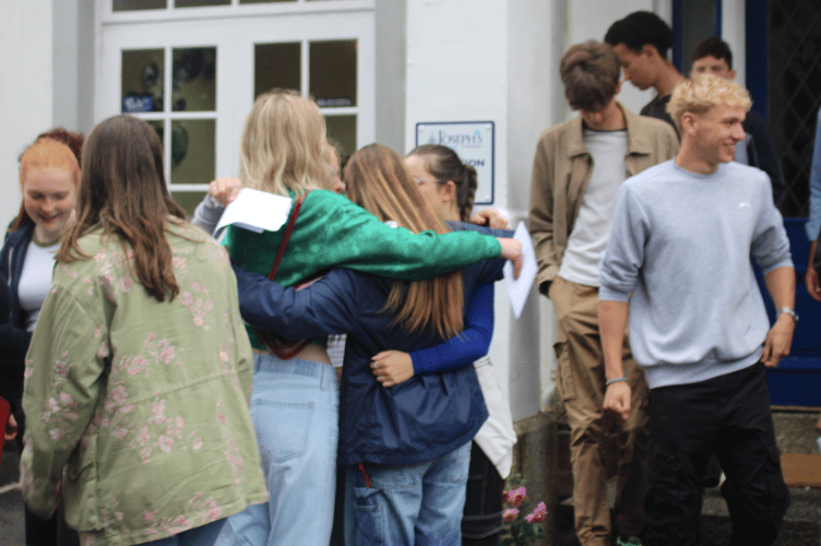 Students celebrated together after collecting their results