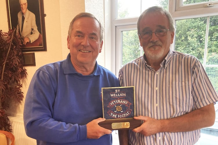 A happy captain of the day, Rob Parsonage, receives the match trophy from Tavistock's Jim McGregor. Picture: St Mellion Golf Club