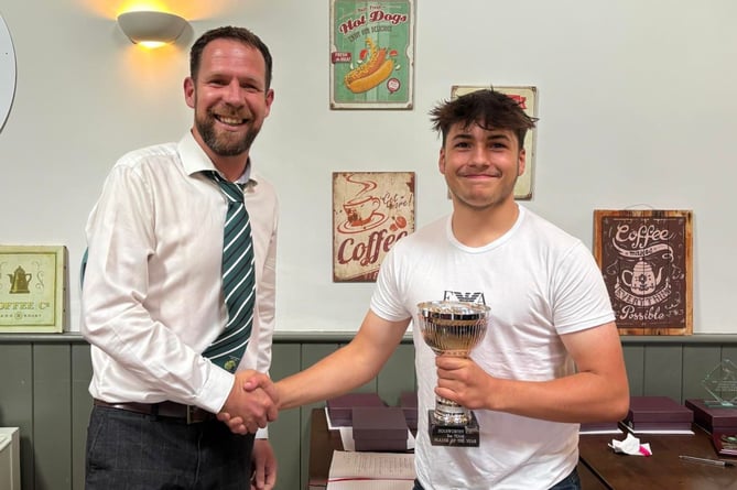 Adam Lovejoy (right) being presented with the second team player of the year award from his captain, Lyndon Piper. Picture: Holsworthy CC