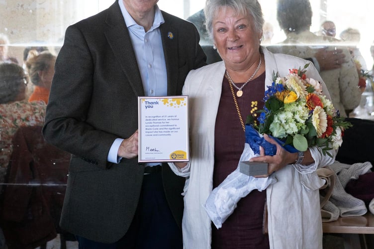 Marie Curie raise over Â£1M for Padstow to Rock swim, presentation by CEO Matthew Reed. Outgoing committee chairman Peter Tamblin, Lynda Thomas