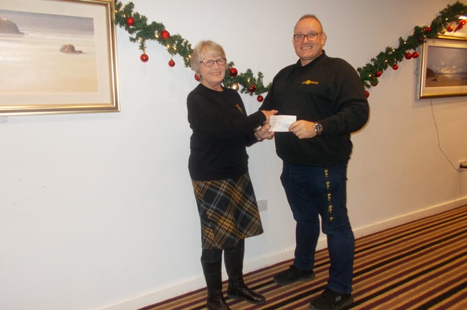 Launceston Inner Wheel president Ann Boundy presented guest speaker Chris Theobald from Man Down with a cheque for £150