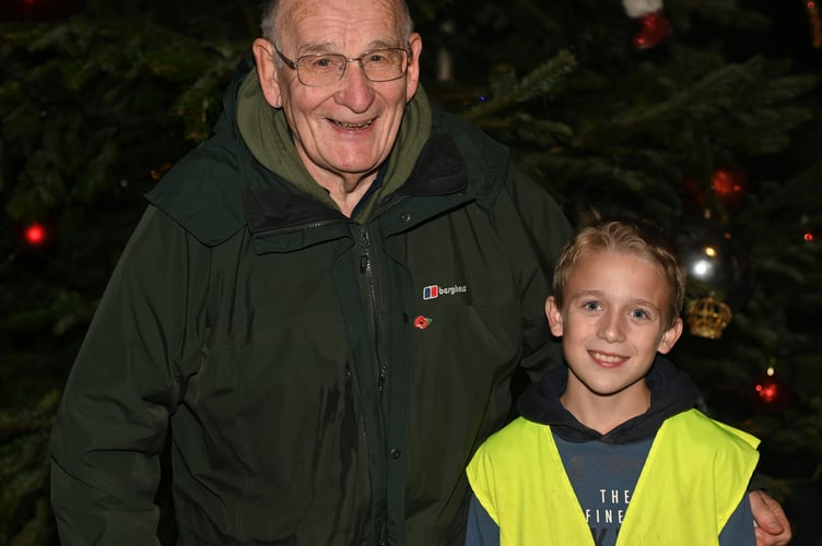 Stanley Reeves gets the honour of turning on this years festive lights in St Teath. Pictured alongside him is Bob Fox, a St Teath Lighting Committee Member. (Picture: Adrian Jasper)