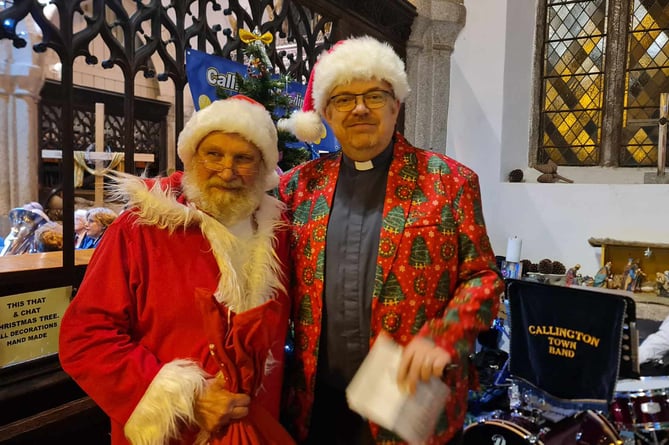 THE Reverend Andy Atkins with Santa (aka Robin West) at Callington's Christmas Tree Festival opening night