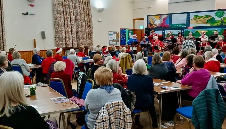 Members of Bude Women's Institute enjoying the entertainment at their Christmas Party