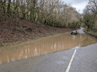 Car abandoned following flooding near A30