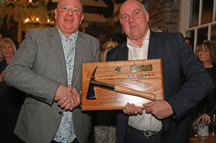 Lee Griffin, Cornwall Fire and Rescue Service group manager for East Command recieves his Silver Plated firefighter presentation axe from Cornwall's deputy chief fire officer Anthony Bartlett (Picture: Adrian Jasper)