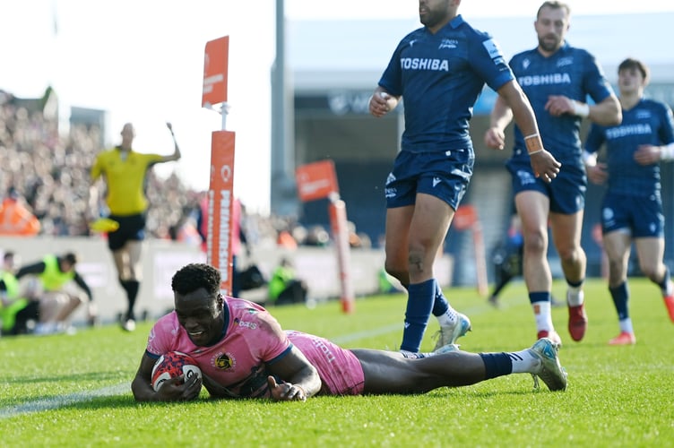 Exeter Chiefs winger Paul Brown-Bampoe crosses for one of his two tries in the Premiership Rugby Cup win over Sale Sharks